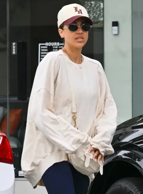 Jessica Alba Spotted in West Hollywood Enjoying a Casual Chat with a Friend 07-22-25