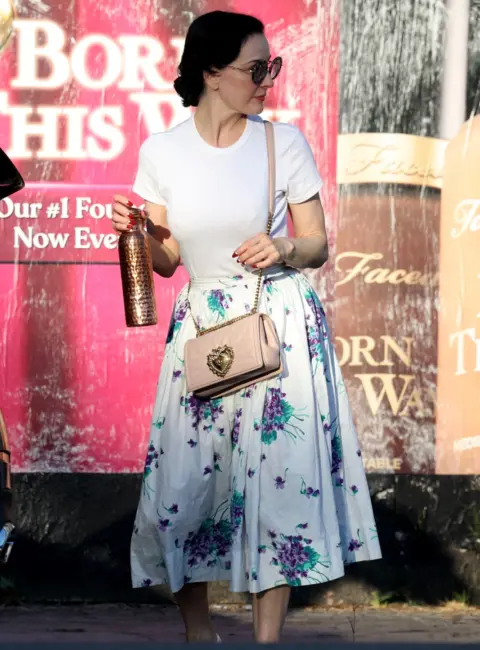 Dita Von Teese Stuns in Vintage Glamour Exiting Exercise Class with Dolce and Gabbana Purse 08-25-2025